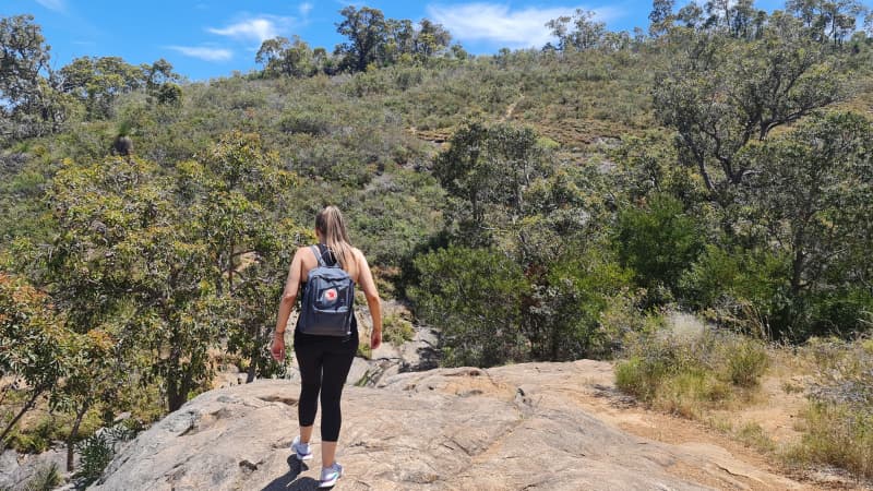 Hiking over an outcrop at Lesmurdie falls