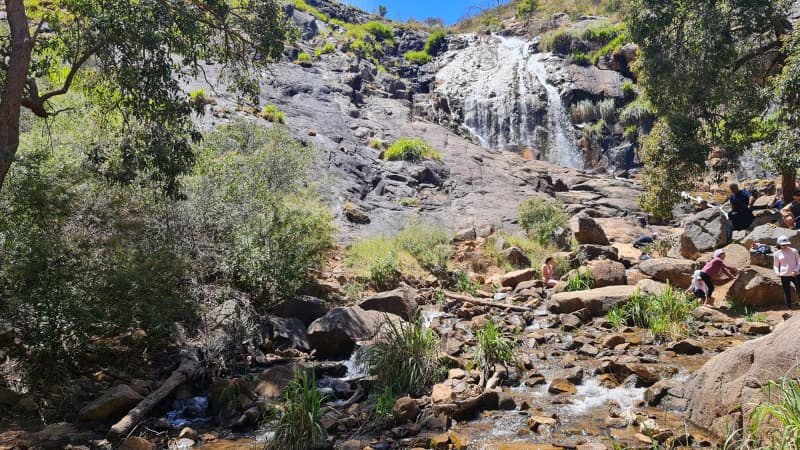 People at the the foot of Lesmurdie falls relaxing