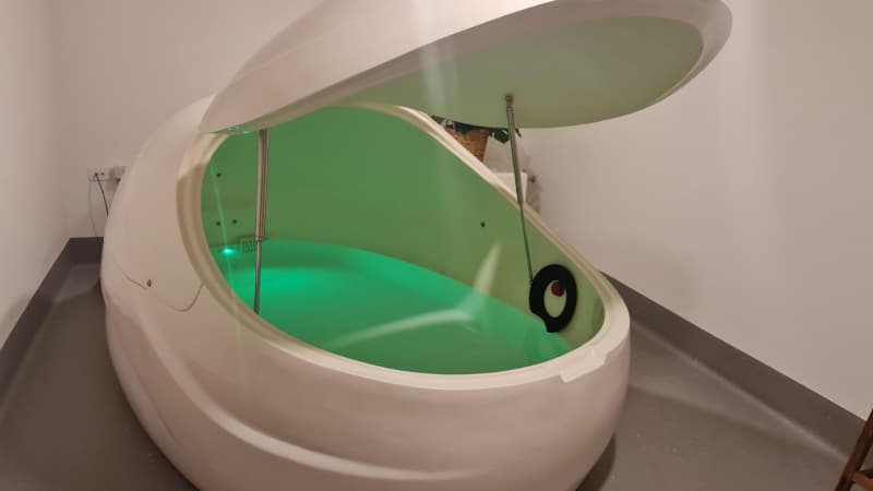 Float tank with green light at clear mind studioind studio