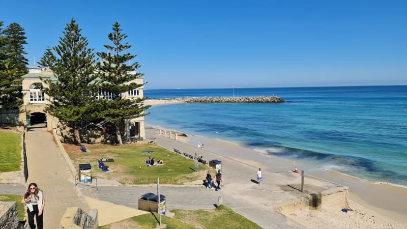 Indian Teahouse in the background with the sand blue water of Cottesloe beach to the right