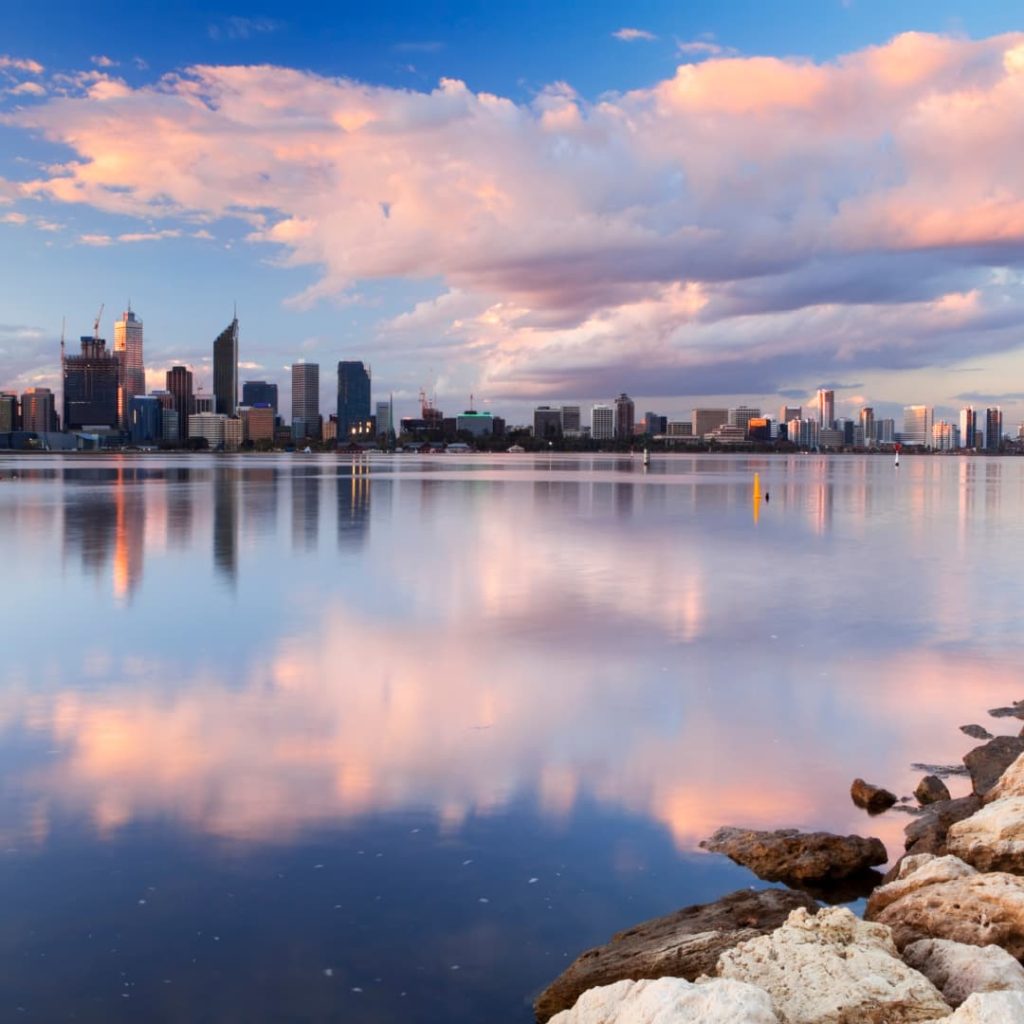 Pink clouds over Perth city skyline at sunrise 