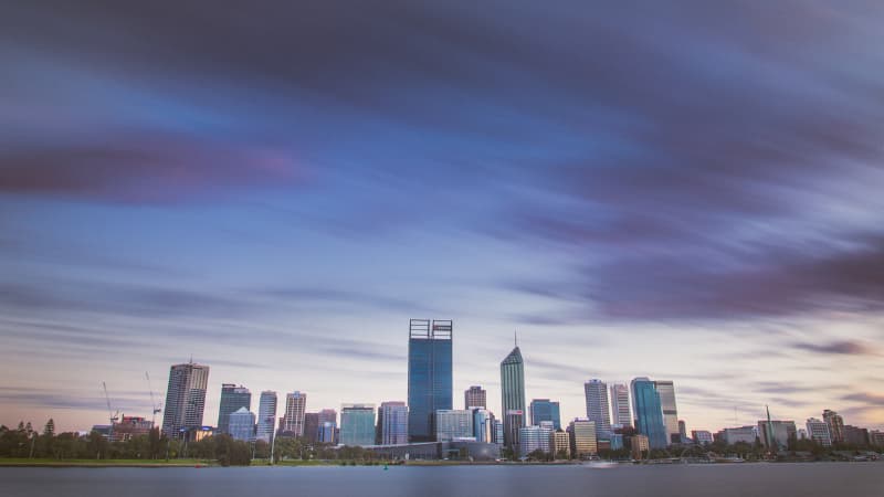 The purple tones of the Perth city skyline at sunrise