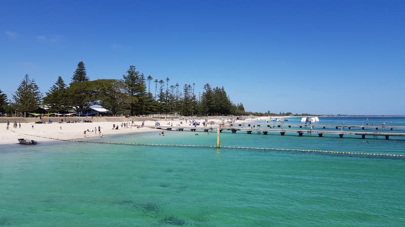 People enjoying the beach swimming and fishing in Busselton