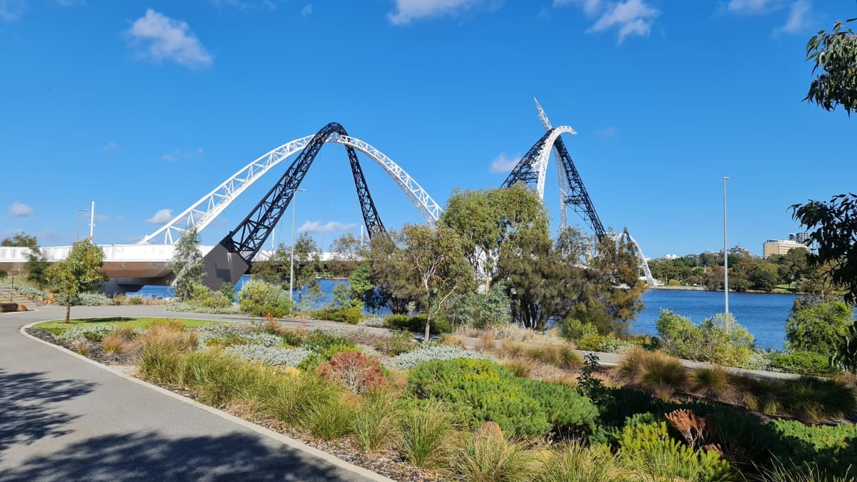 Matagarup Bridge stretches over the Swan river on a clear day.