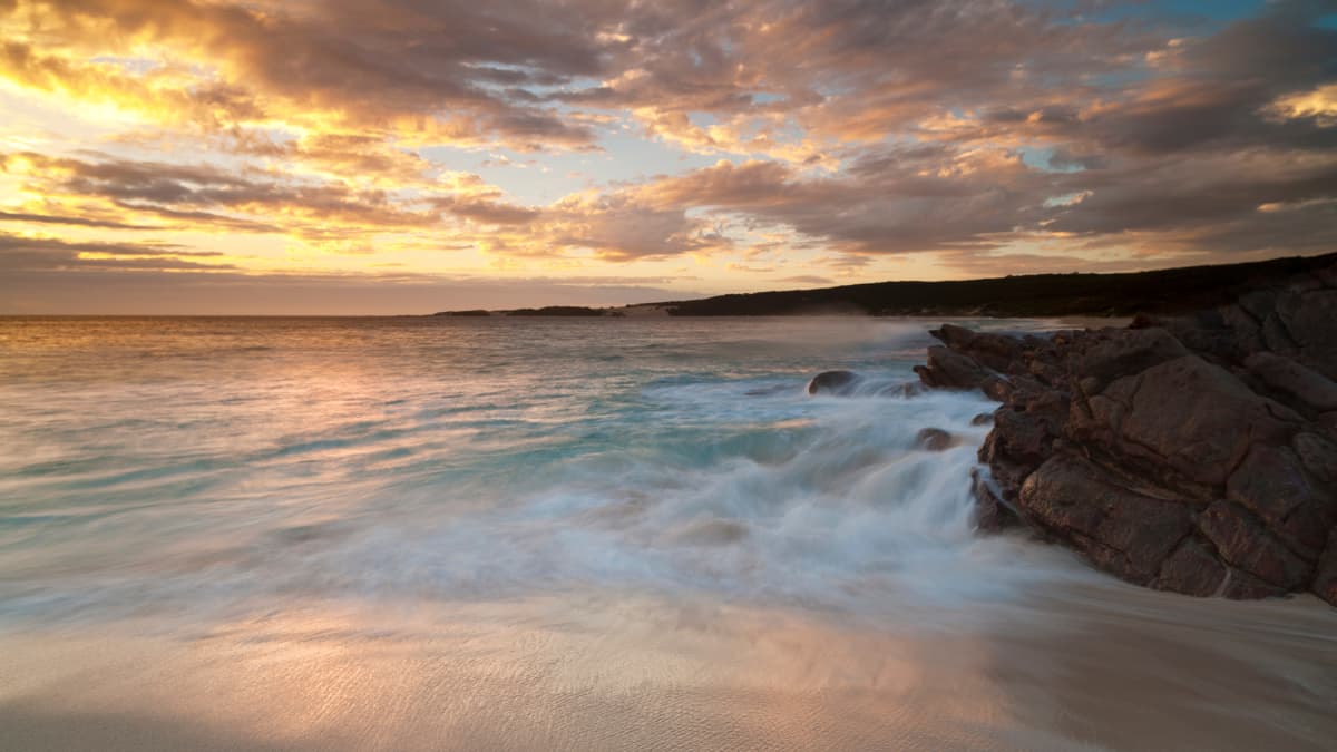 Cape Naturaliste Waves crashing against rocks at sunset on the coast near Yallingup